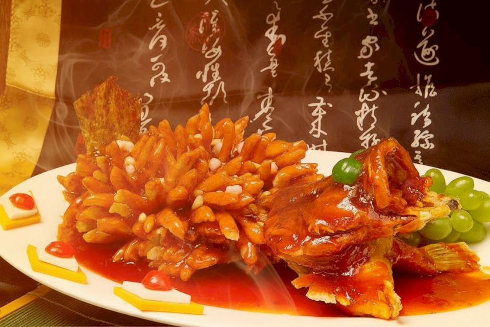 The fish fans out into a porcupine-like shape, making it as visually striking as it is flavorful